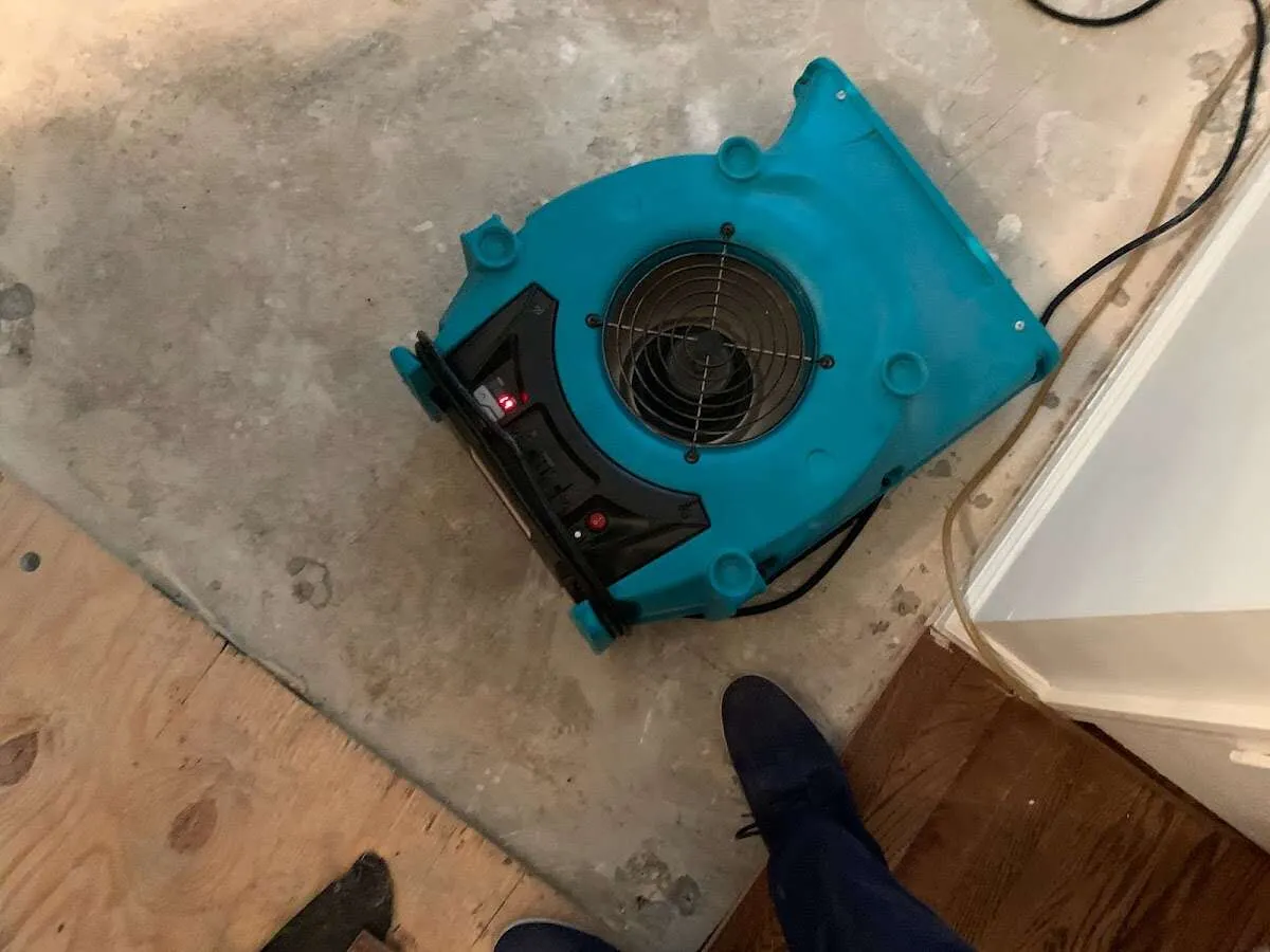 Air mover drying subfloor during Leak Detection & Repair in La Riviera